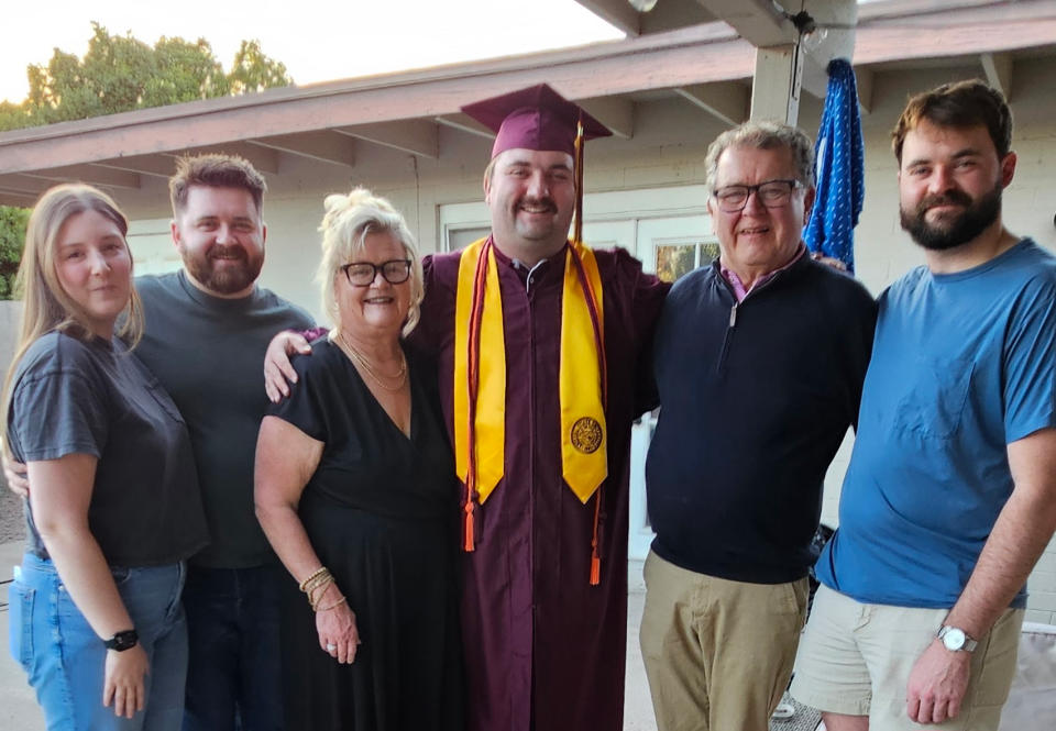 Arlan Swenson with his family at a graduation celebration
